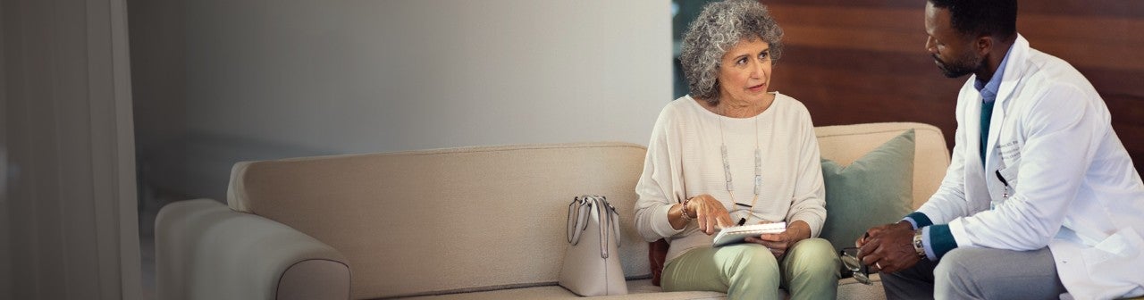 Smiling man climbing outdoors.