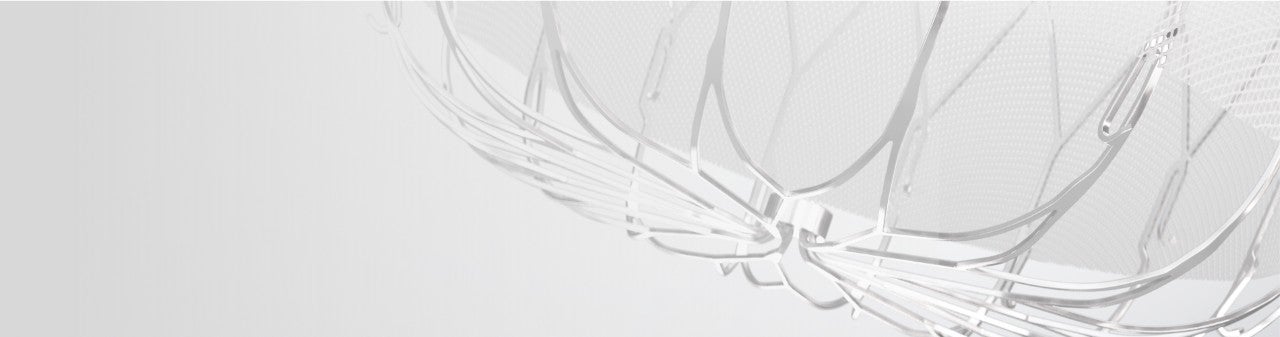 Close up view of the WATCHMAN implant on a gray background