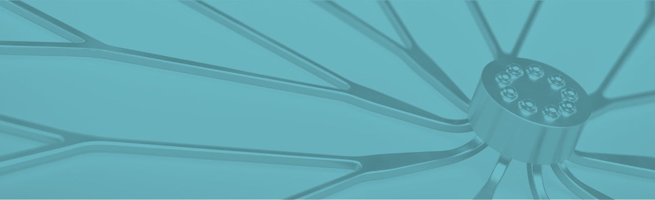 Close up view of the WATCHMAN implant on a blue background