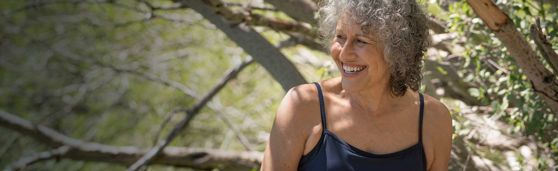 woman sitting near lake
