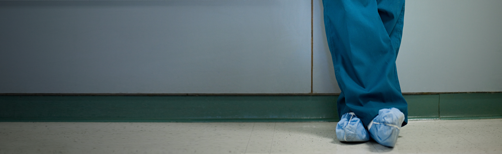 implanter legs and feet standing in hospital