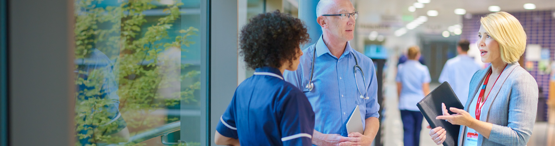 physician and administrator in discussion at hospital