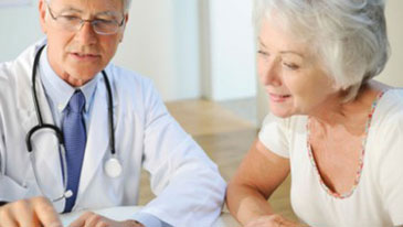 A doctor and a patient discuss LAA treatment. 