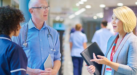 Hospital staff having a conversation with administration